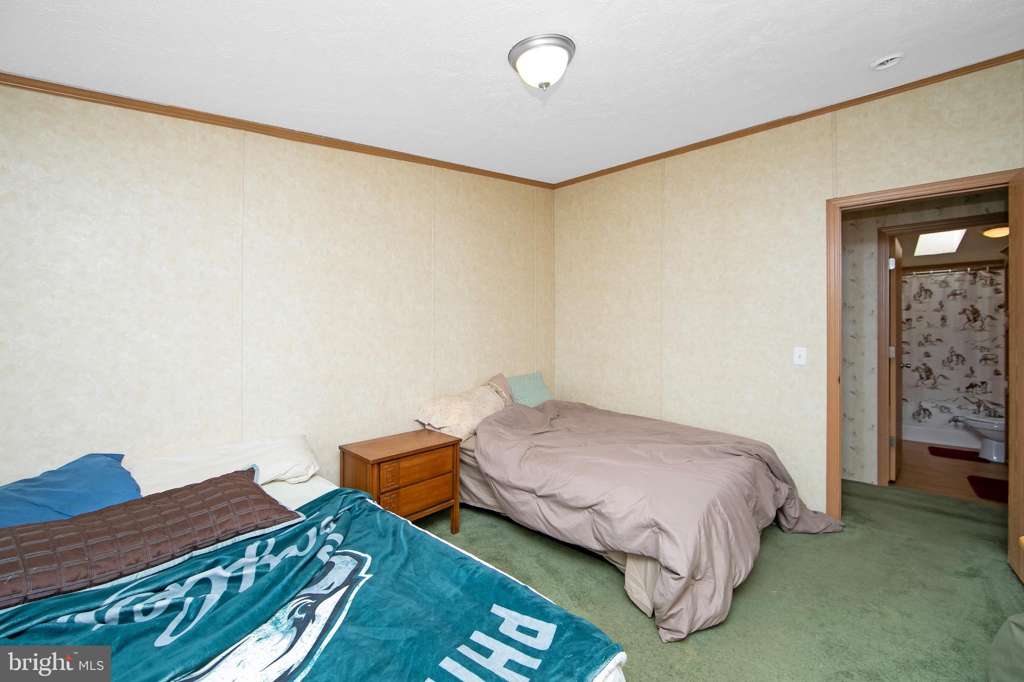 54 Three Bridge Road Monroeville, NJ 08343 - Photo 28 of 35 a bedroom with a bed and dresser