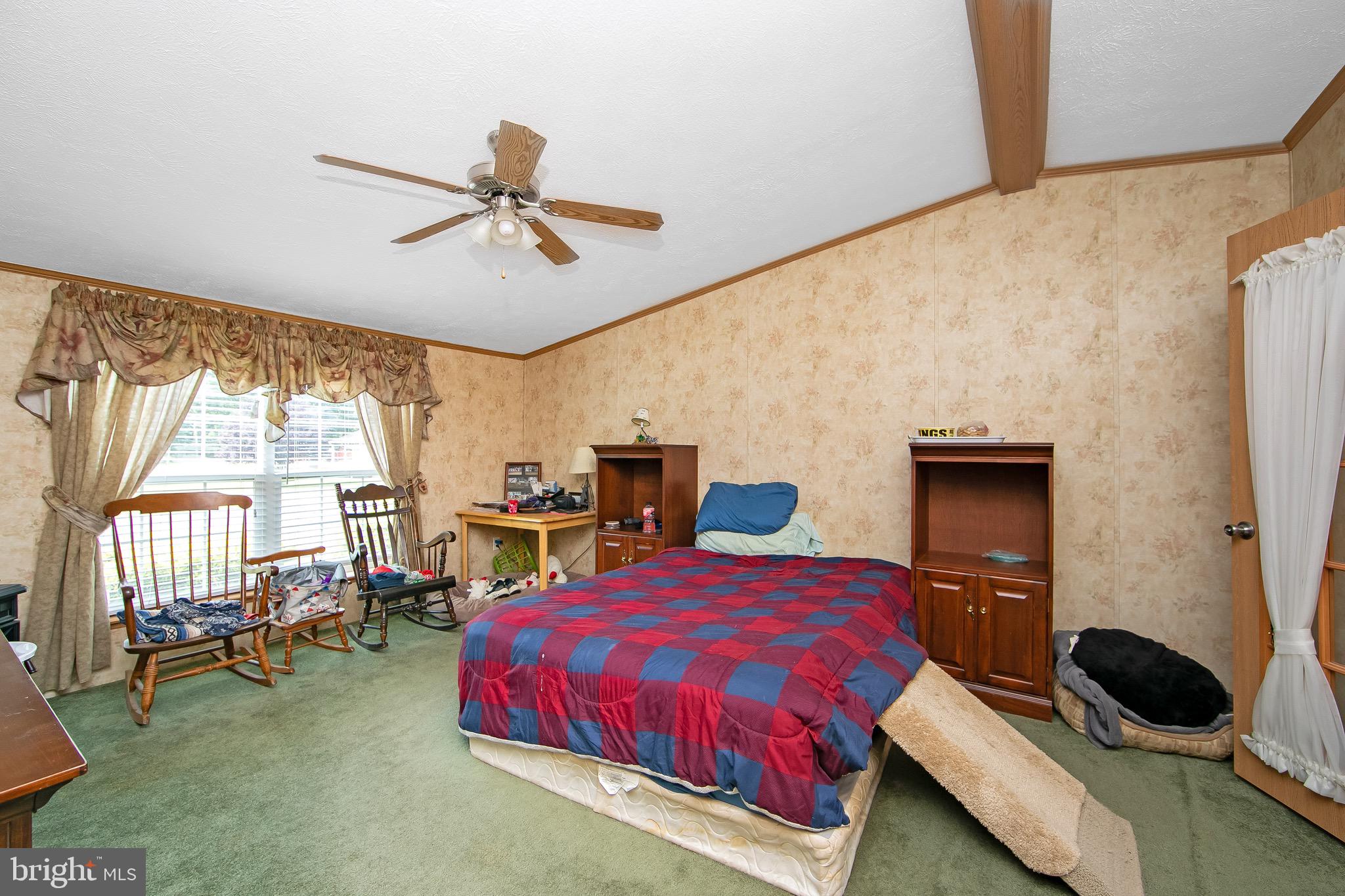 54 Three Bridge Road Monroeville, NJ 08343 - Photo 30 of 35 a bedroom with a bed a table and chair