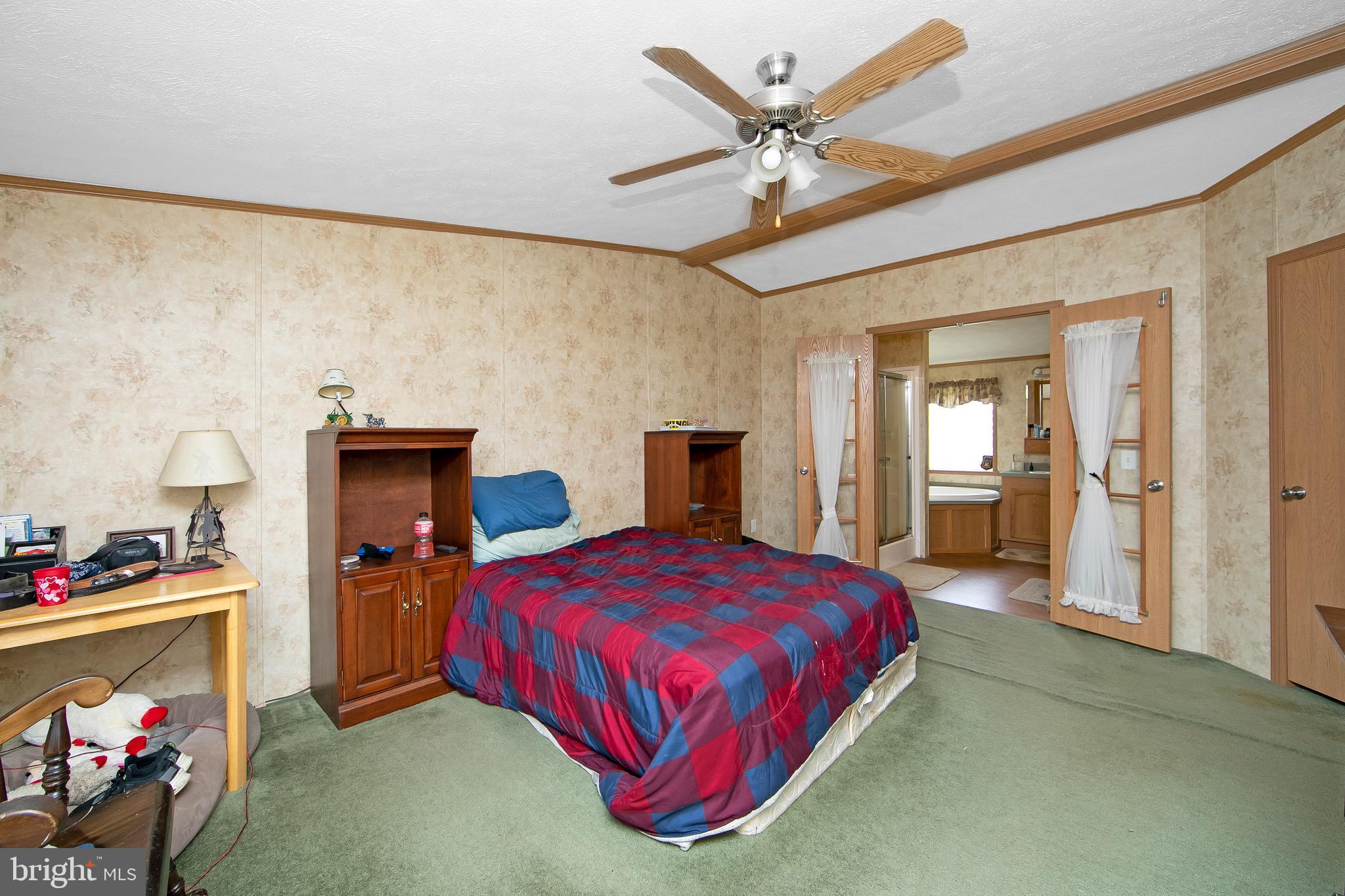 54 Three Bridge Road Monroeville, NJ 08343 - Photo 31 of 35 a bedroom with a bed and cabinets