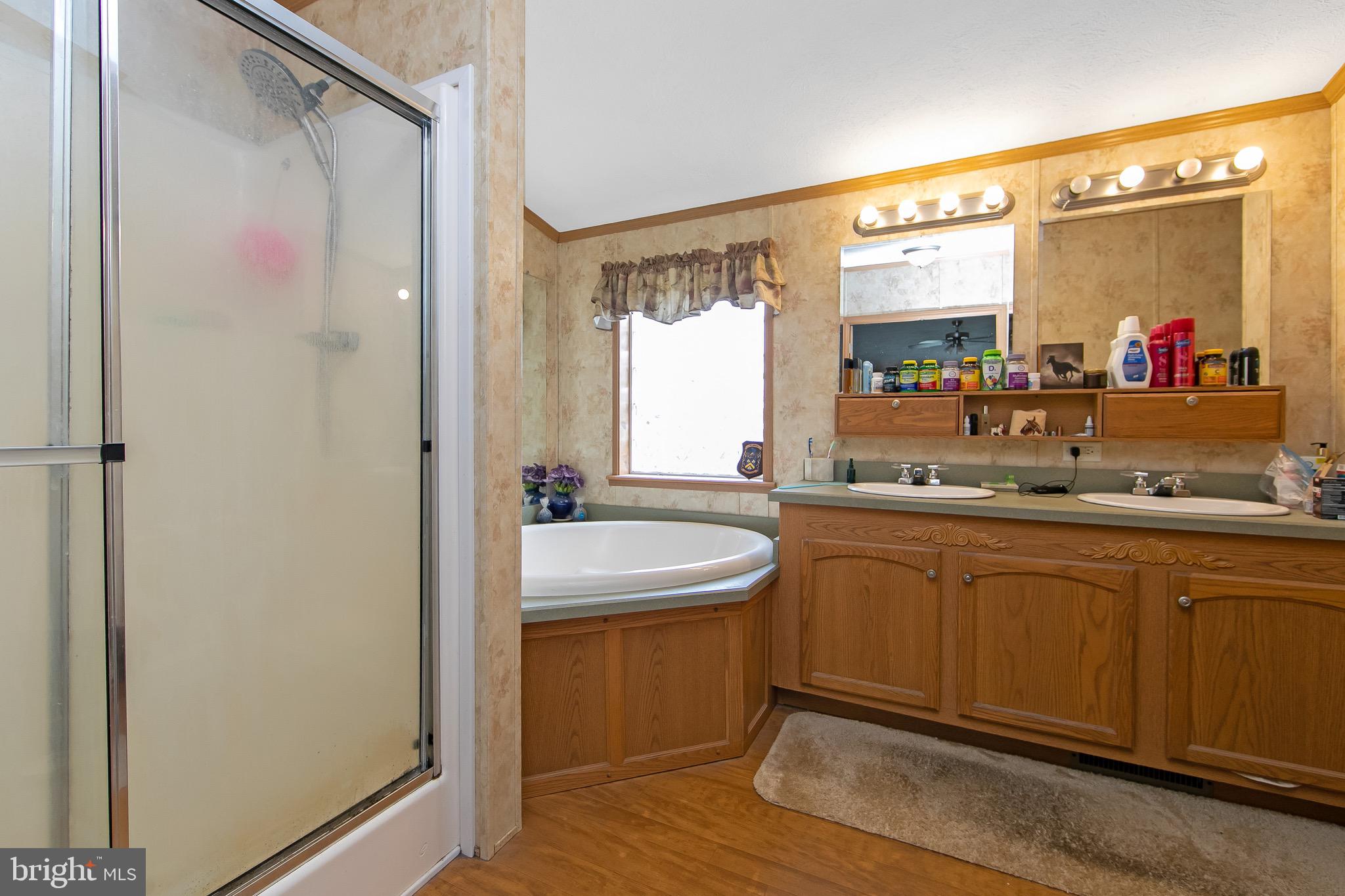 54 Three Bridge Road Monroeville, NJ 08343 - Photo 33 of 35 a bathroom with a sink and a mirror