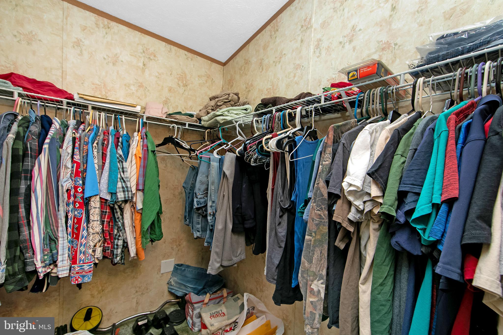 54 Three Bridge Road Monroeville, NJ 08343 - Photo 34 of 35 a view of walk in closet with clothes