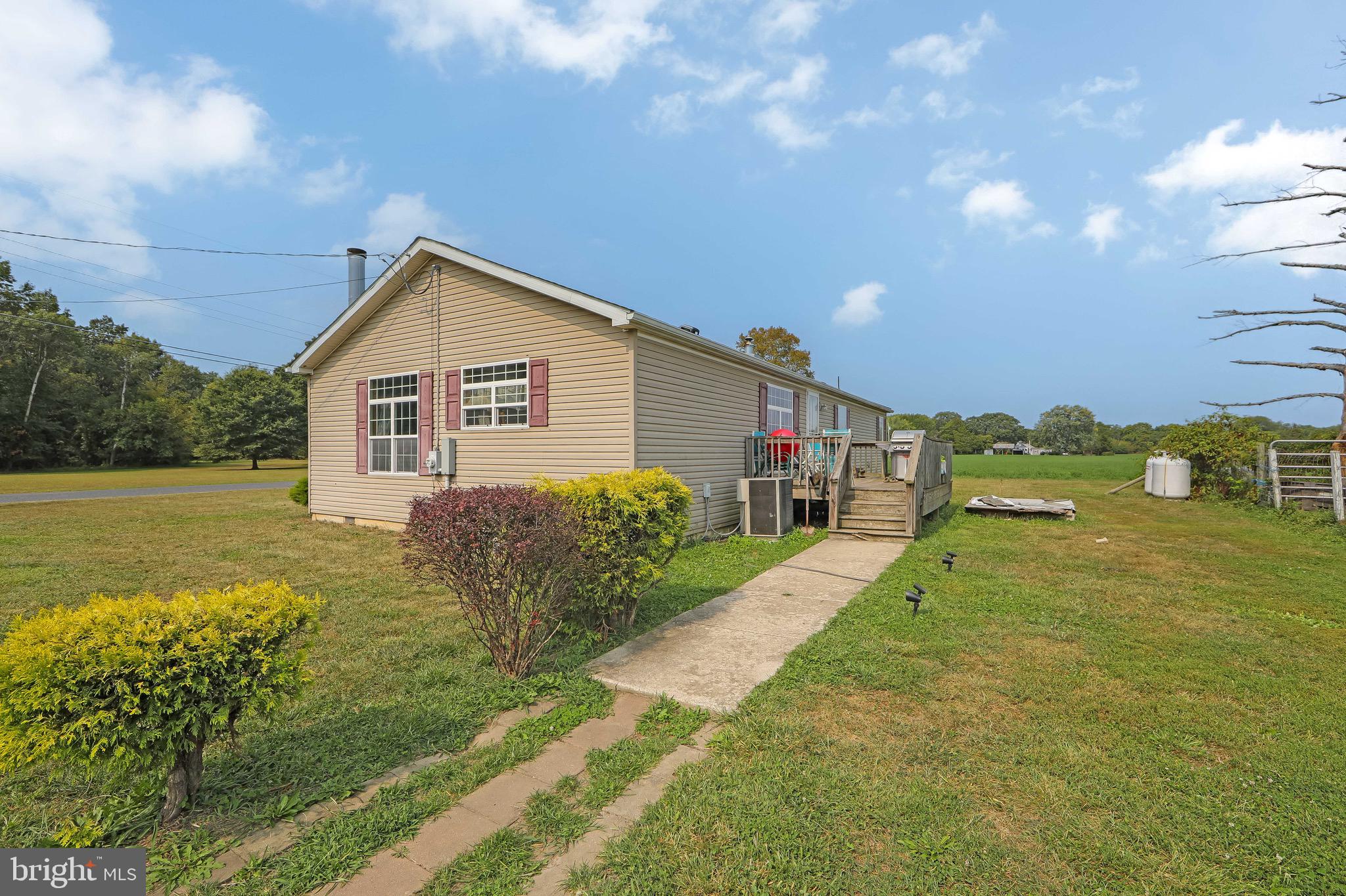 54 Three Bridge Road Monroeville, NJ 08343 - Photo 6 of 35 a view of a house with a yard