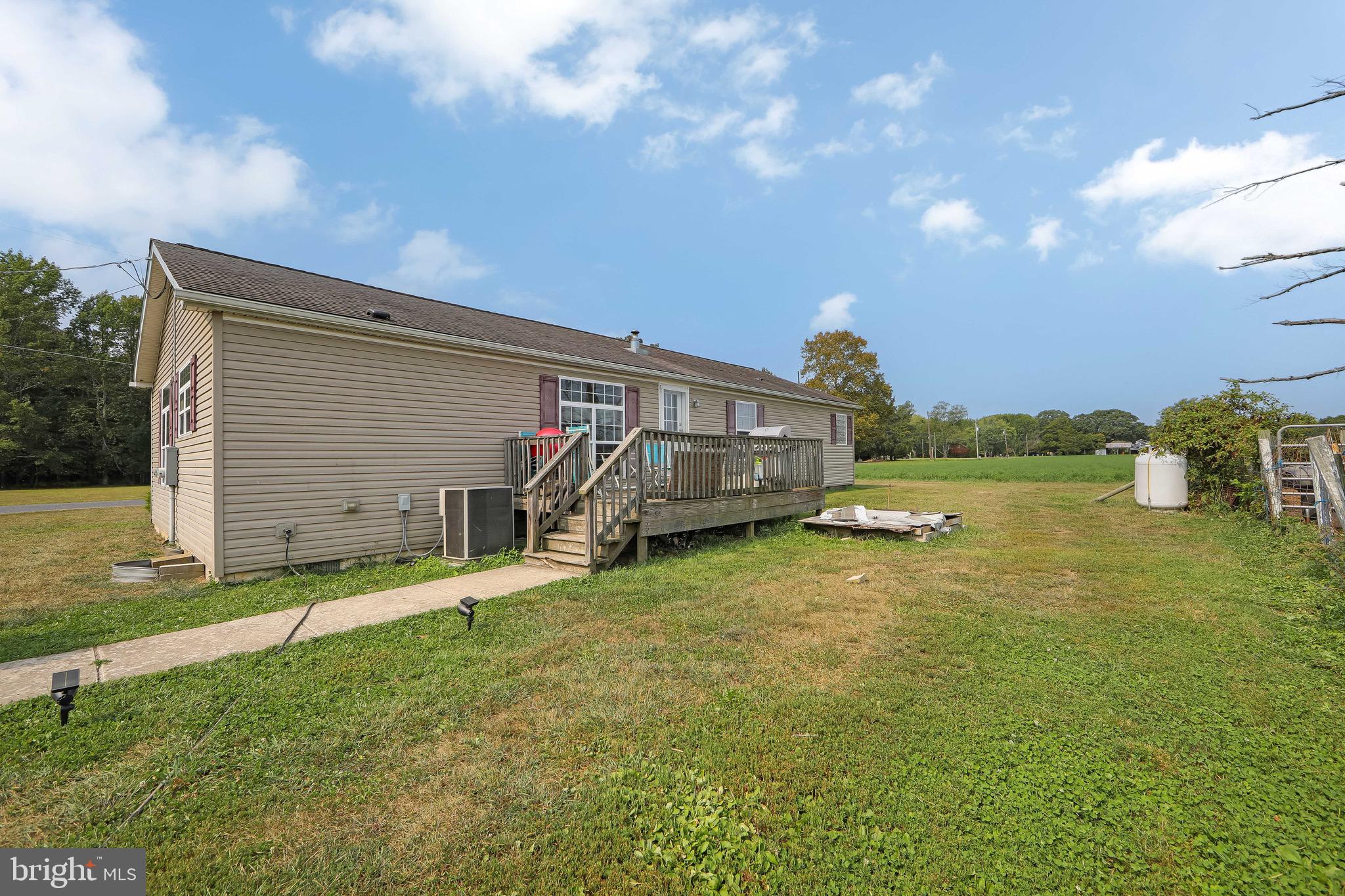 54 Three Bridge Road Monroeville, NJ 08343 - Photo 7 of 35 a front view of a house with a yard