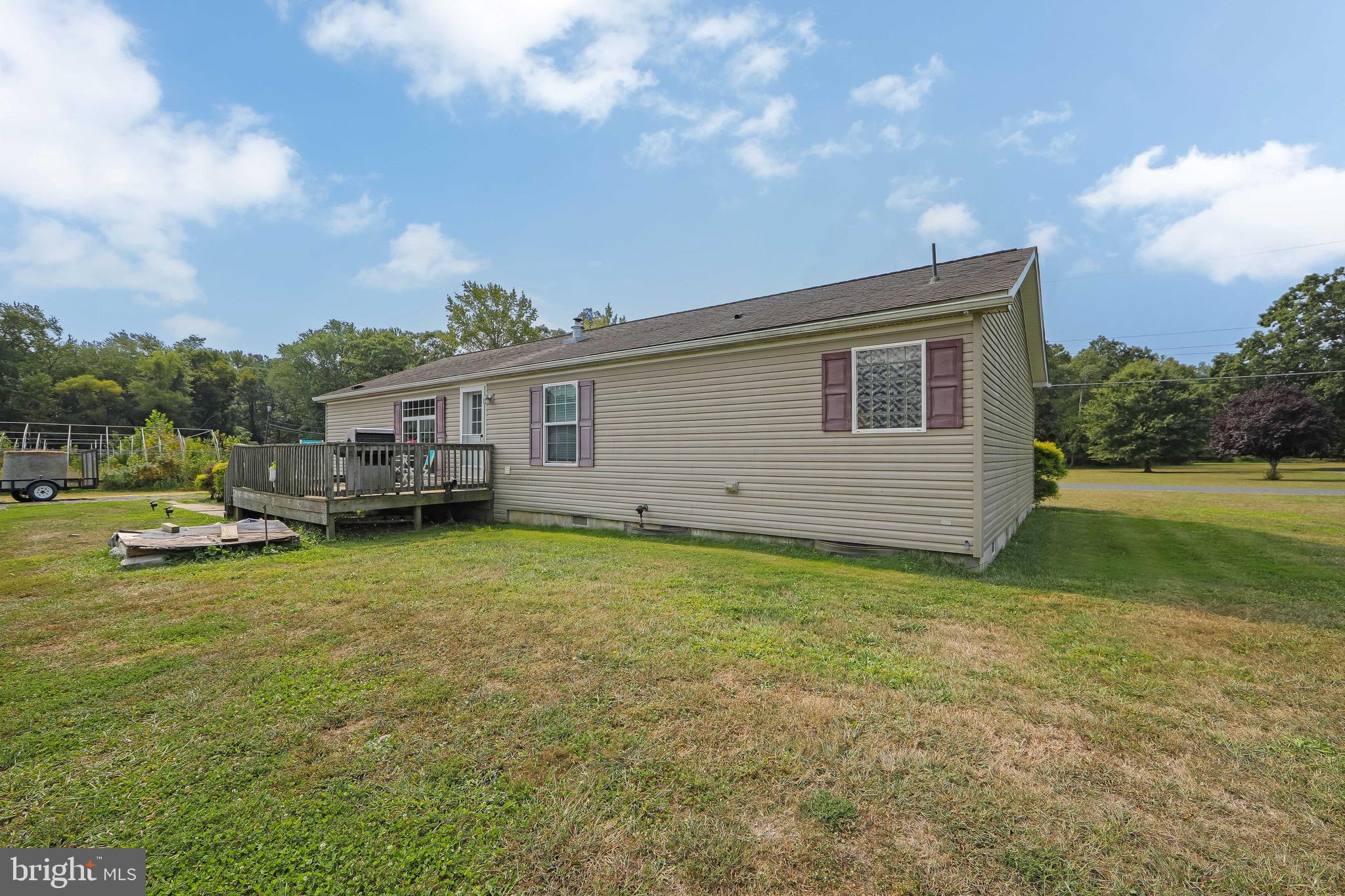 54 Three Bridge Road Monroeville, NJ 08343 - Photo 10 of 35 a view of a house with a backyard