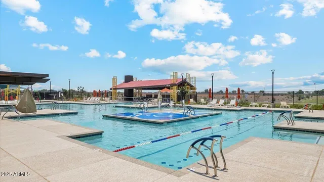 a view of a swimming pool with a lounge chairs
