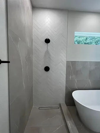a bathroom with a white bath tub