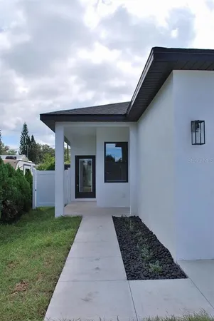 a house view with a backyard space