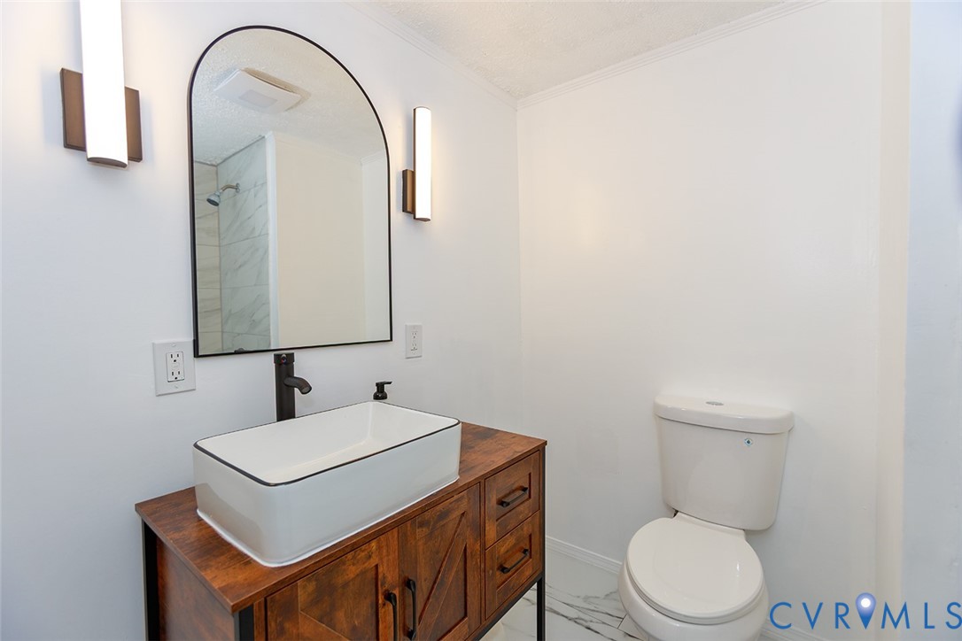 925 Fluvanna Road Newport News, VA 23601 - Photo 14 of 25 a bathroom with a toilet sink and mirror