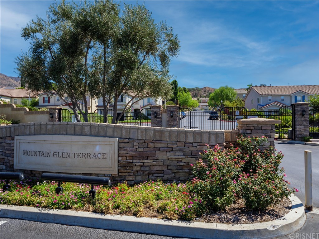 13040 Angeles Trail Way Sylmar, CA 91342 - Photo 1 of 1 a view of a sign board with flower