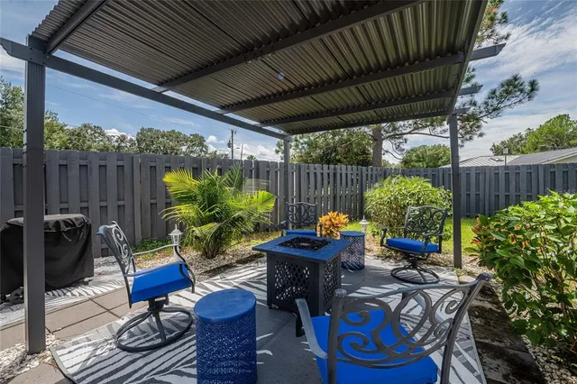 a view of an outdoor sitting area with furniture