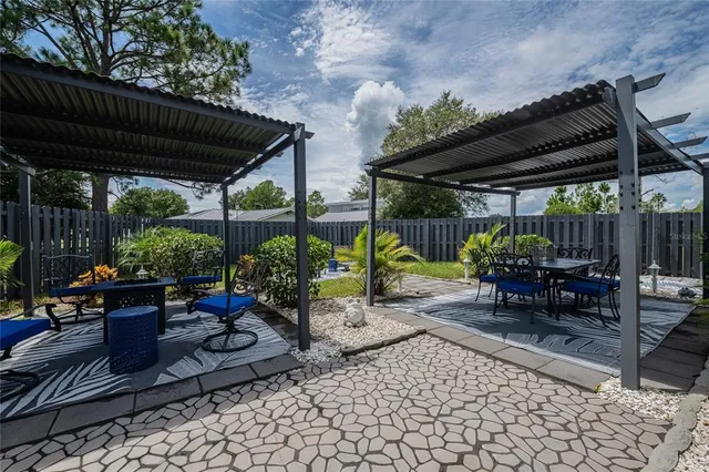 a view of a chairs and table in a patio