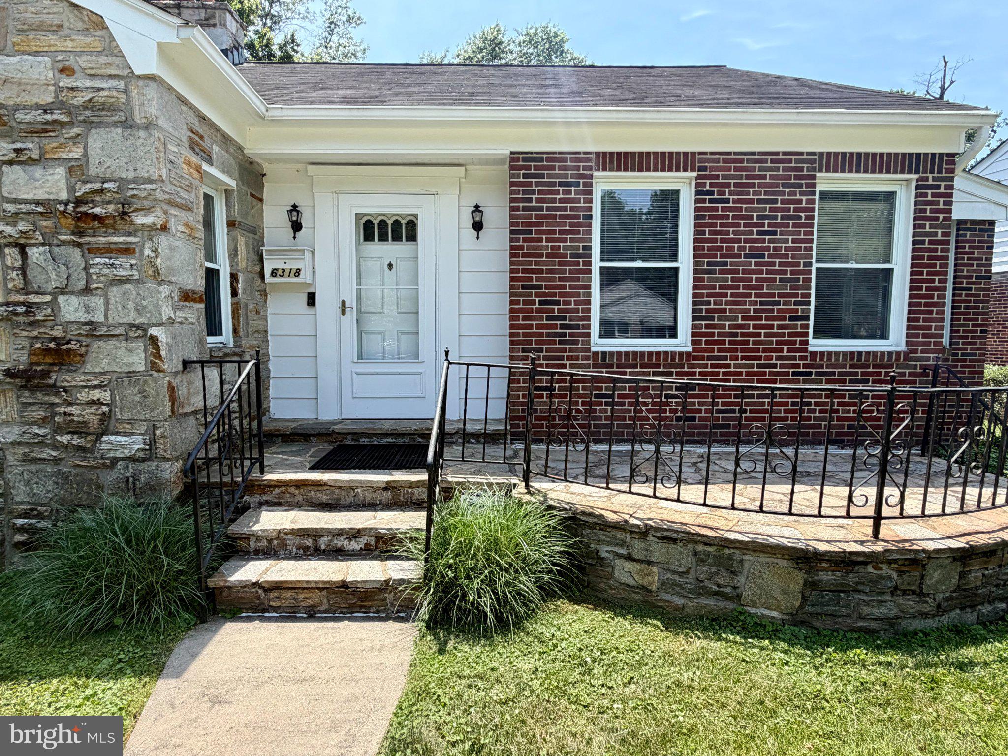 6318 Winner Avenue Baltimore, MD 21215 - Photo 6 of 75 a front view of a house with a yard