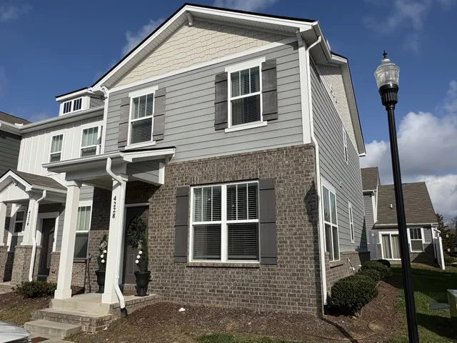 a front view of a house with a garage