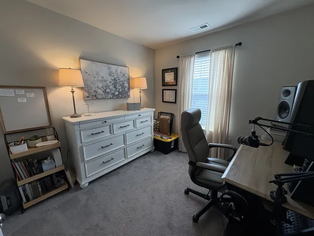 a room with a sink and a mirror