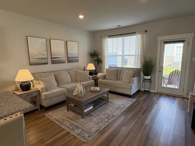 a living room with furniture and a window