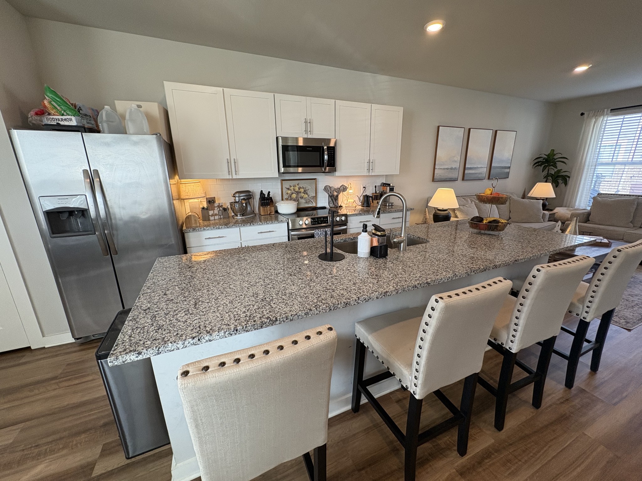 4228 Gandalf Lane Murfreesboro, TN 37128 - Photo 6 of 17 a kitchen with granite countertop a sink counter top space appliances and cabinets