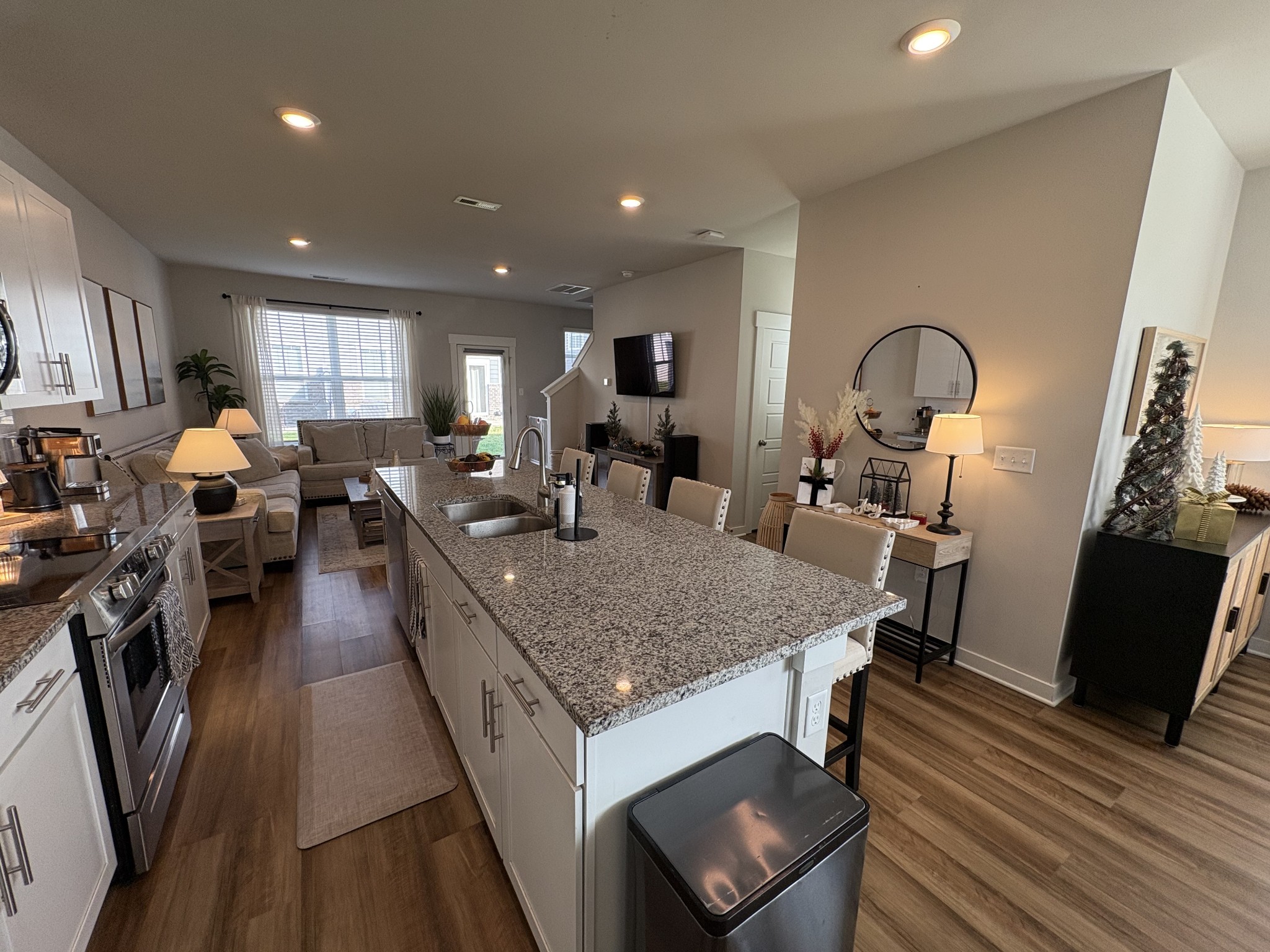 4228 Gandalf Lane Murfreesboro, TN 37128 - Photo 7 of 17 a large kitchen with stainless steel appliances granite countertop a lot of counter space and wooden floor