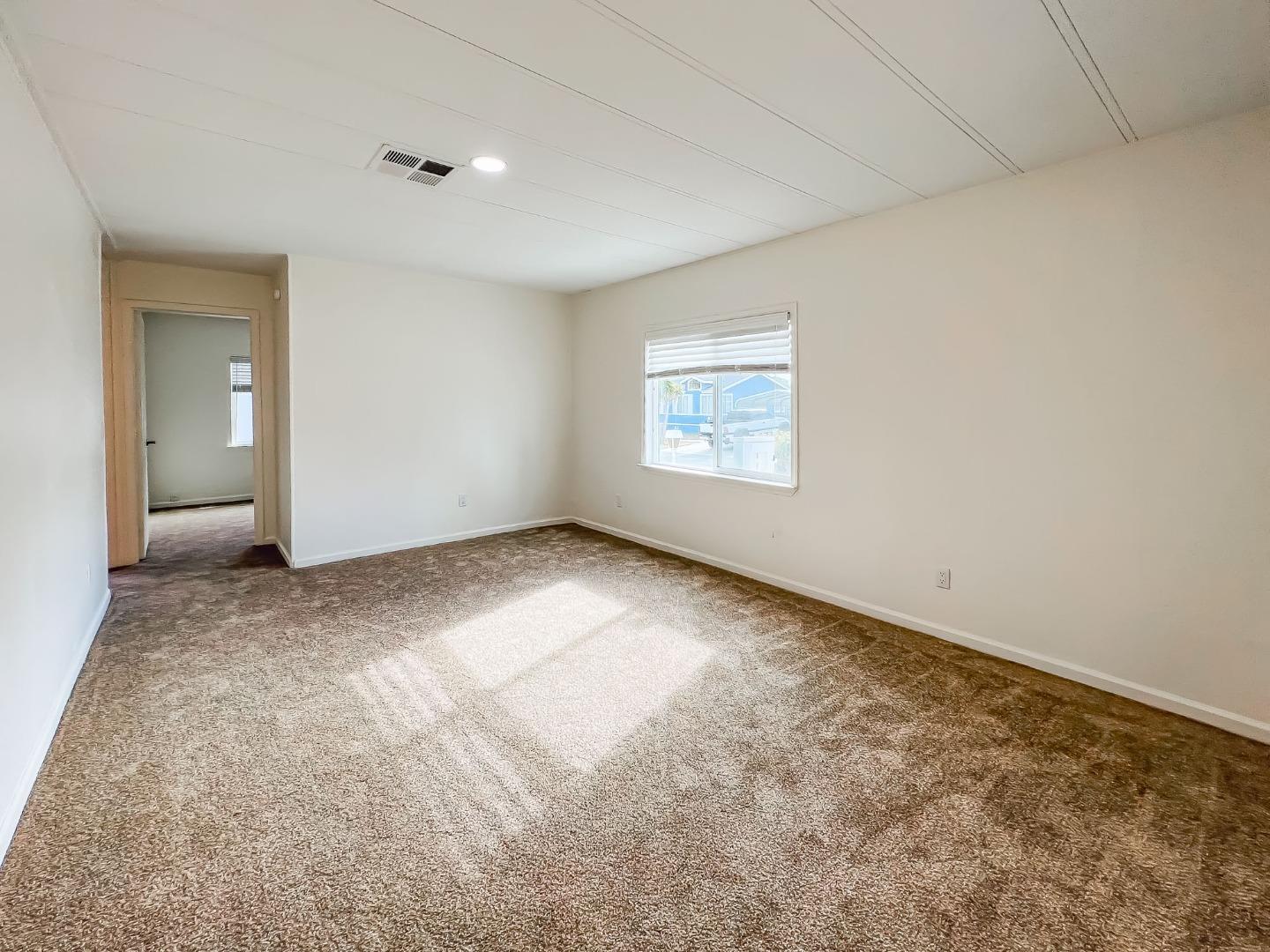 800 Dolan Road, Unit 40 Moss Landing, CA 95039 - Photo 13 of 23 an empty room with windows