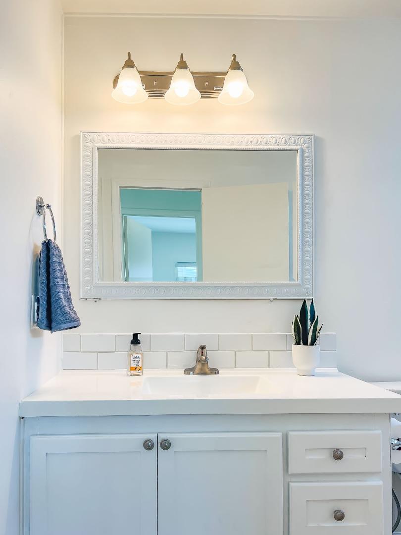 800 Dolan Road, Unit 40 Moss Landing, CA 95039 - Photo 19 of 23 a bathroom with a sink and a mirror