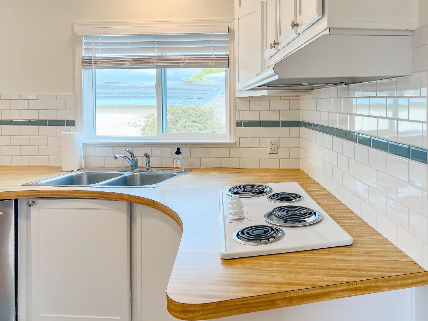 800 Dolan Road, Unit 40 Moss Landing, CA 95039 - Photo 7 of 23 a kitchen with a stove a sink and a cabinets