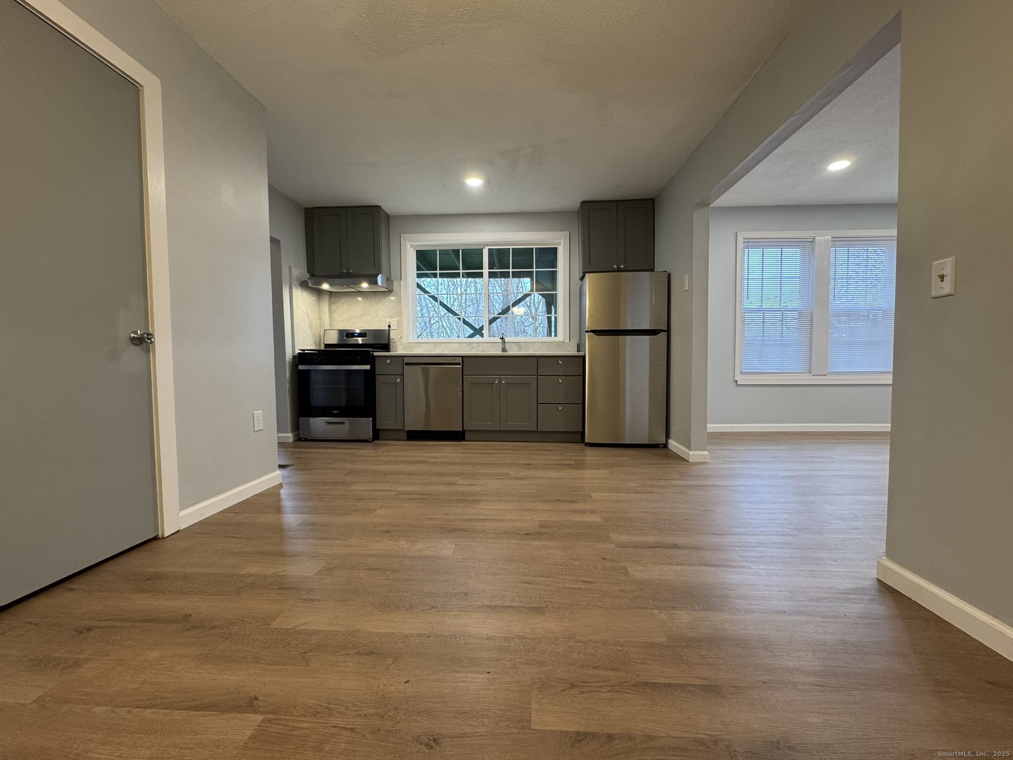 9 South Street, Unit B Cromwell, CT 06416 - Photo 13 of 18 a living room with furniture and a flat screen tv