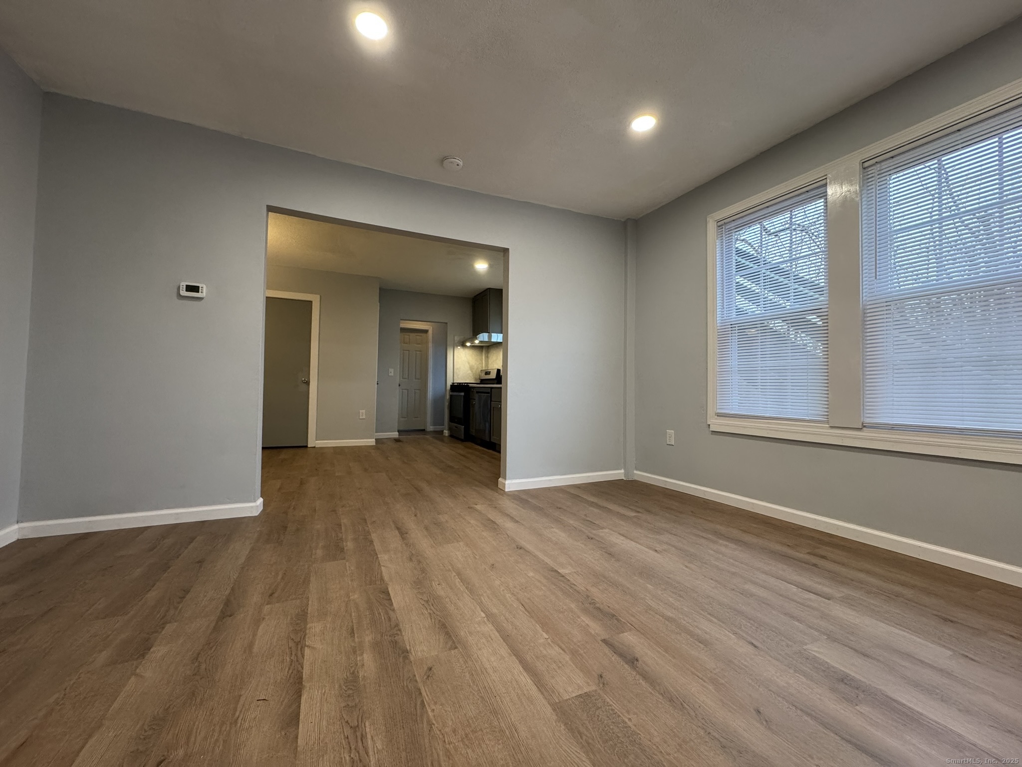 9 South Street, Unit B Cromwell, CT 06416 - Photo 18 of 18 wooden floor in an empty room with a window