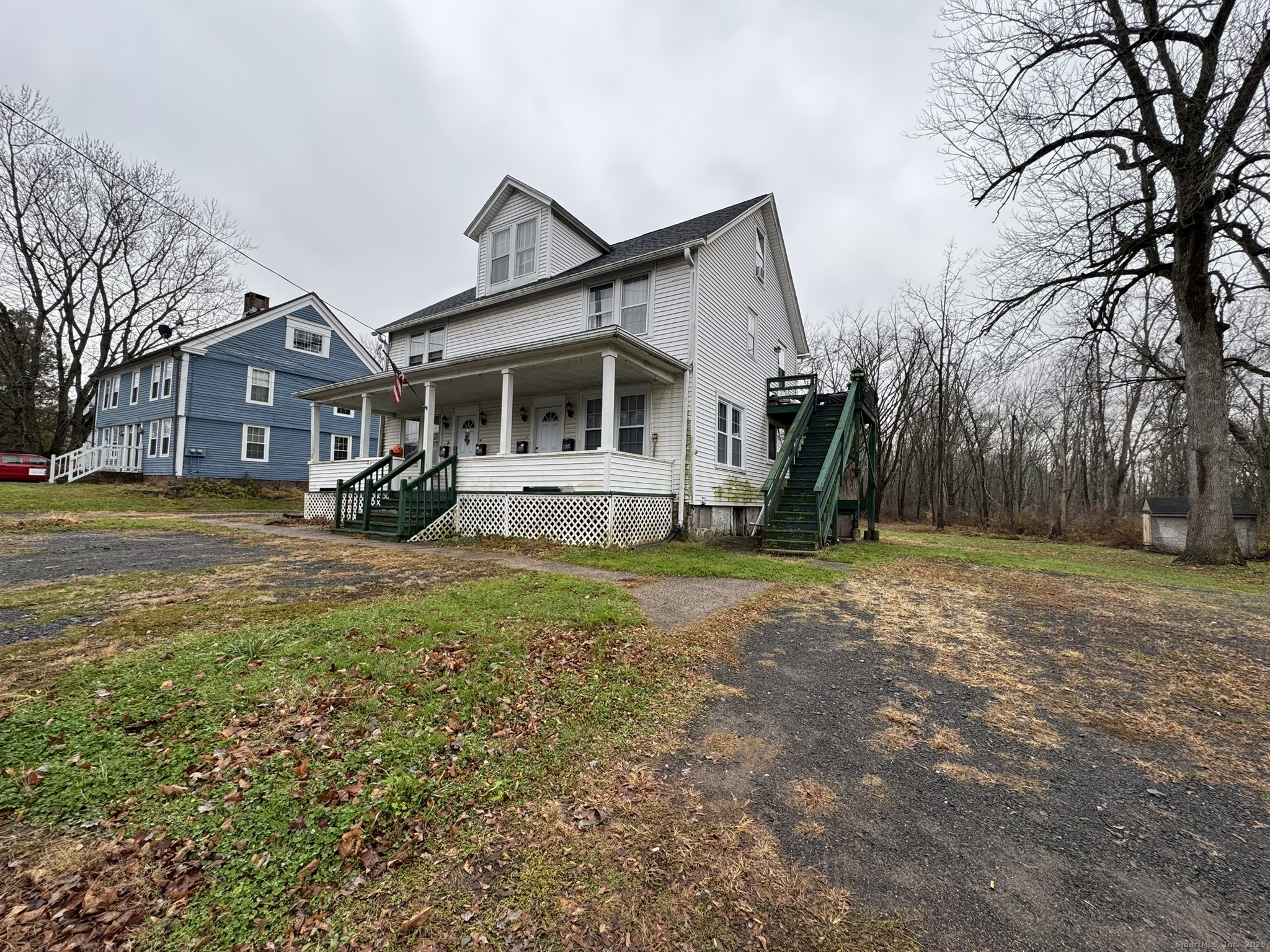 9 South Street, Unit B Cromwell, CT 06416 - Photo 2 of 18 a front view of a house with a yard
