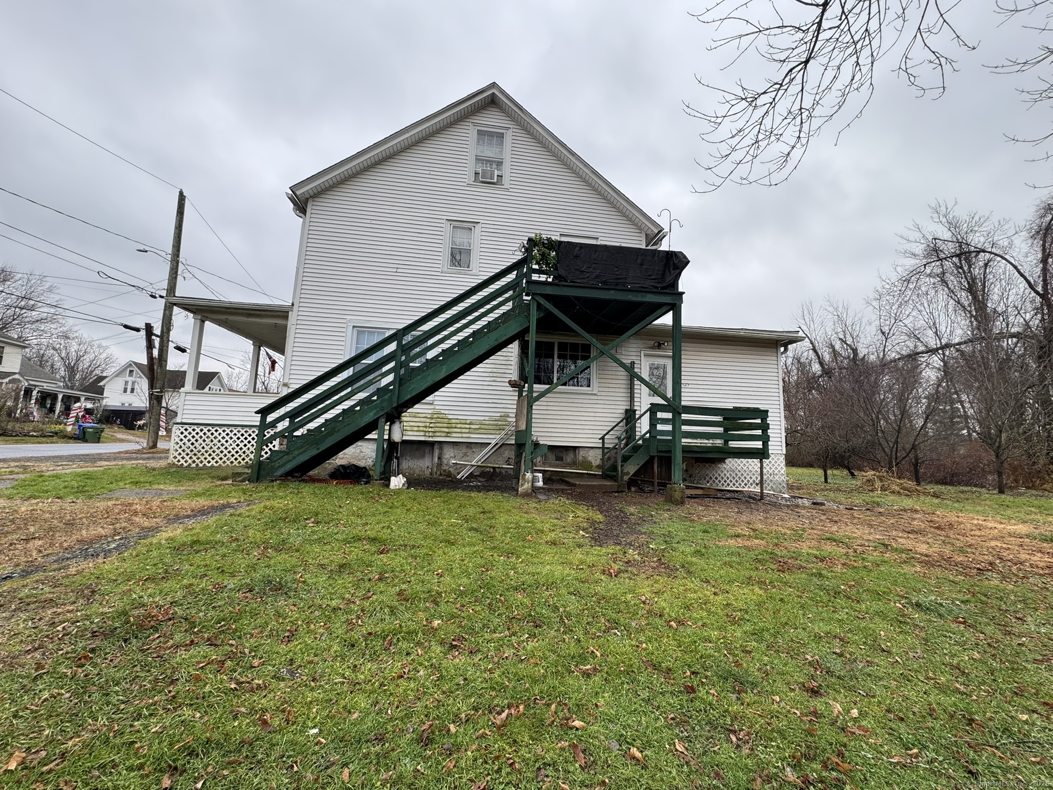 9 South Street, Unit B Cromwell, CT 06416 - Photo 3 of 18 a view of a house with a yard