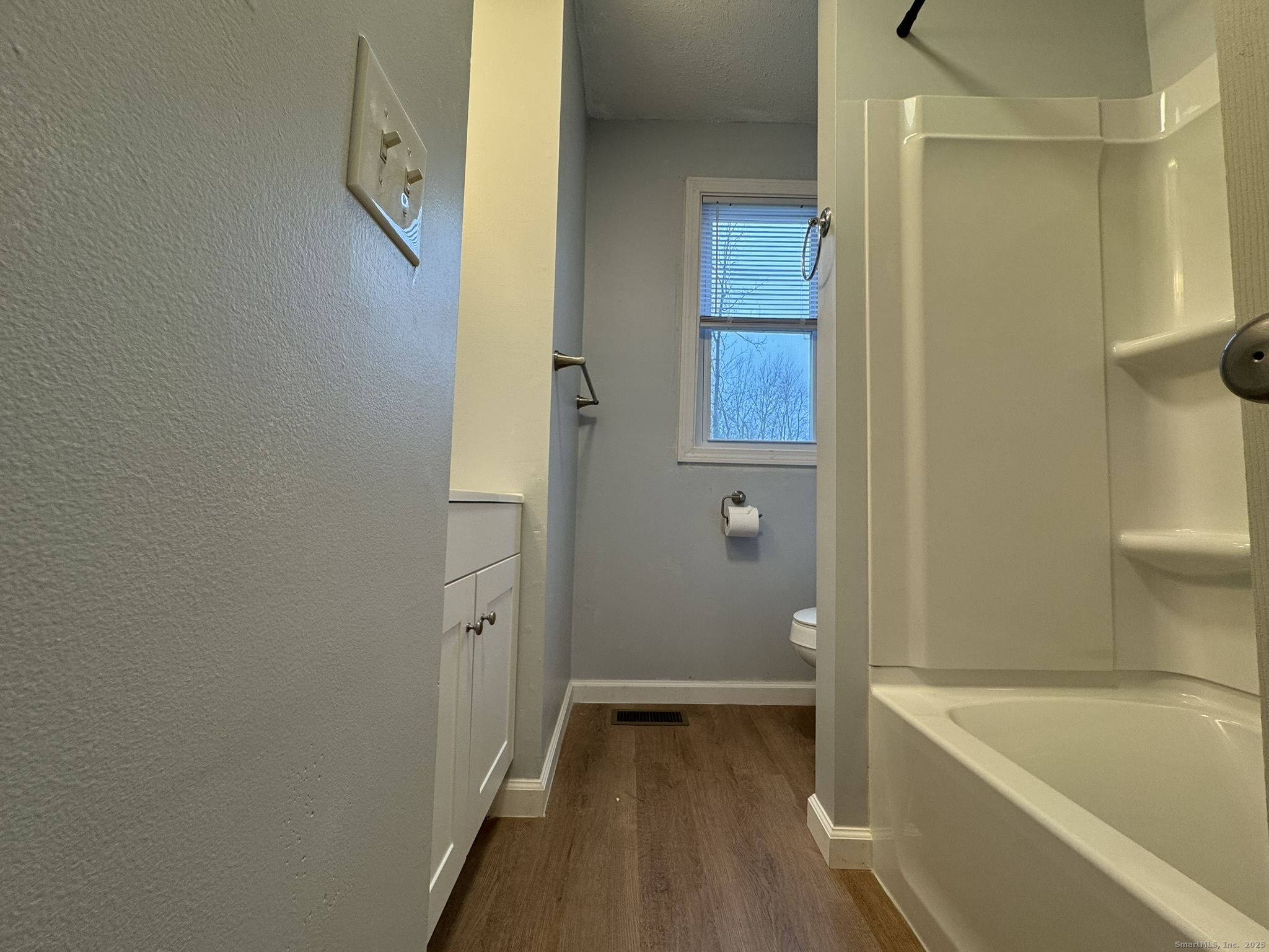 9 South Street, Unit B Cromwell, CT 06416 - Photo 7 of 18 a bathroom with a tub and shower