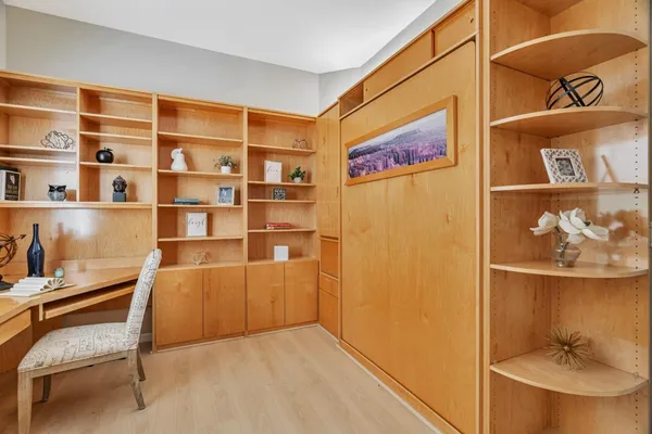 a view of workspace with cabinets