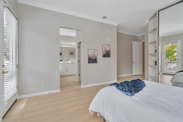 a bedroom with a bed and closet