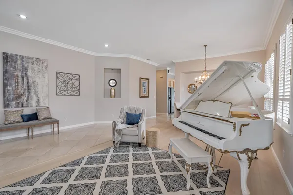 a living room with furniture and a rug