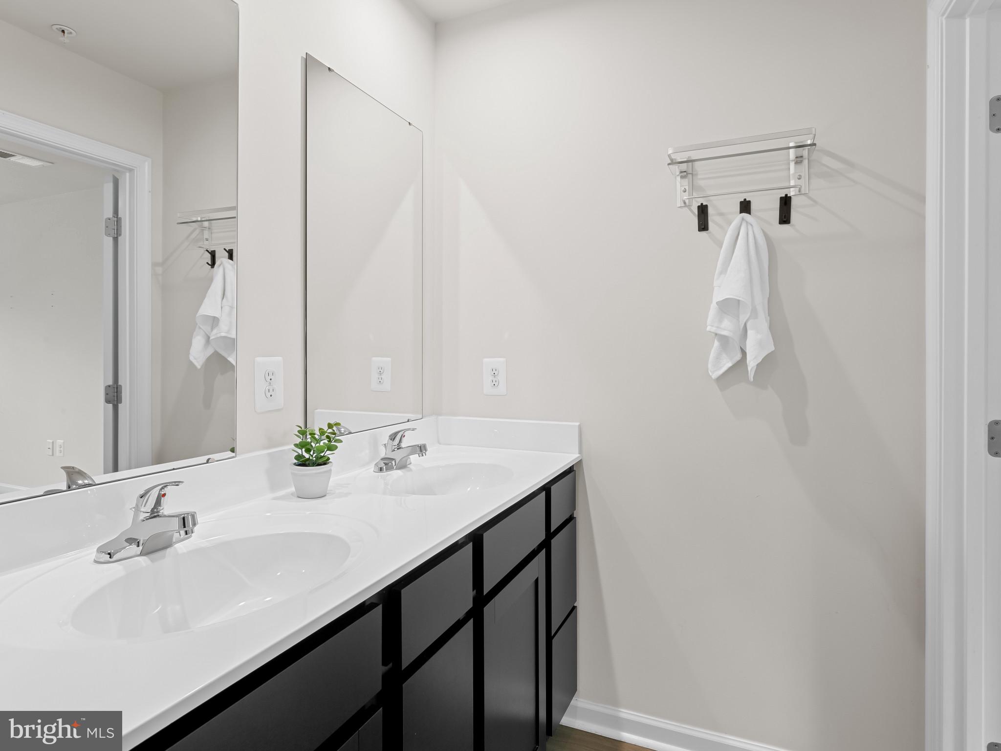 5505 Vergo Road Capitol Heights, MD 20743 - Photo 19 of 42 a bathroom with a sink and mirror