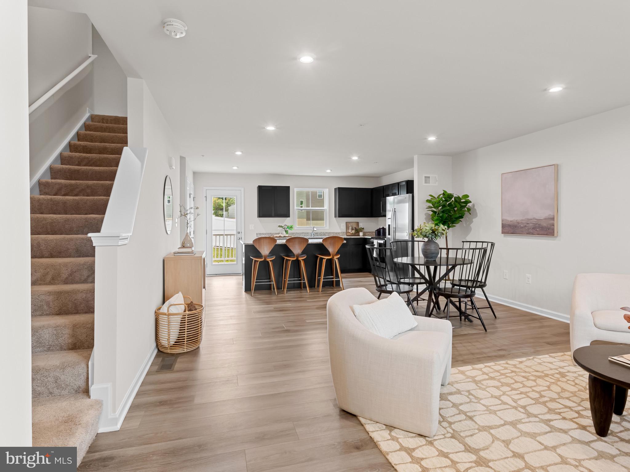 5505 Vergo Road Capitol Heights, MD 20743 - Photo 4 of 42 a living room with furniture a wooden floor and next to a window