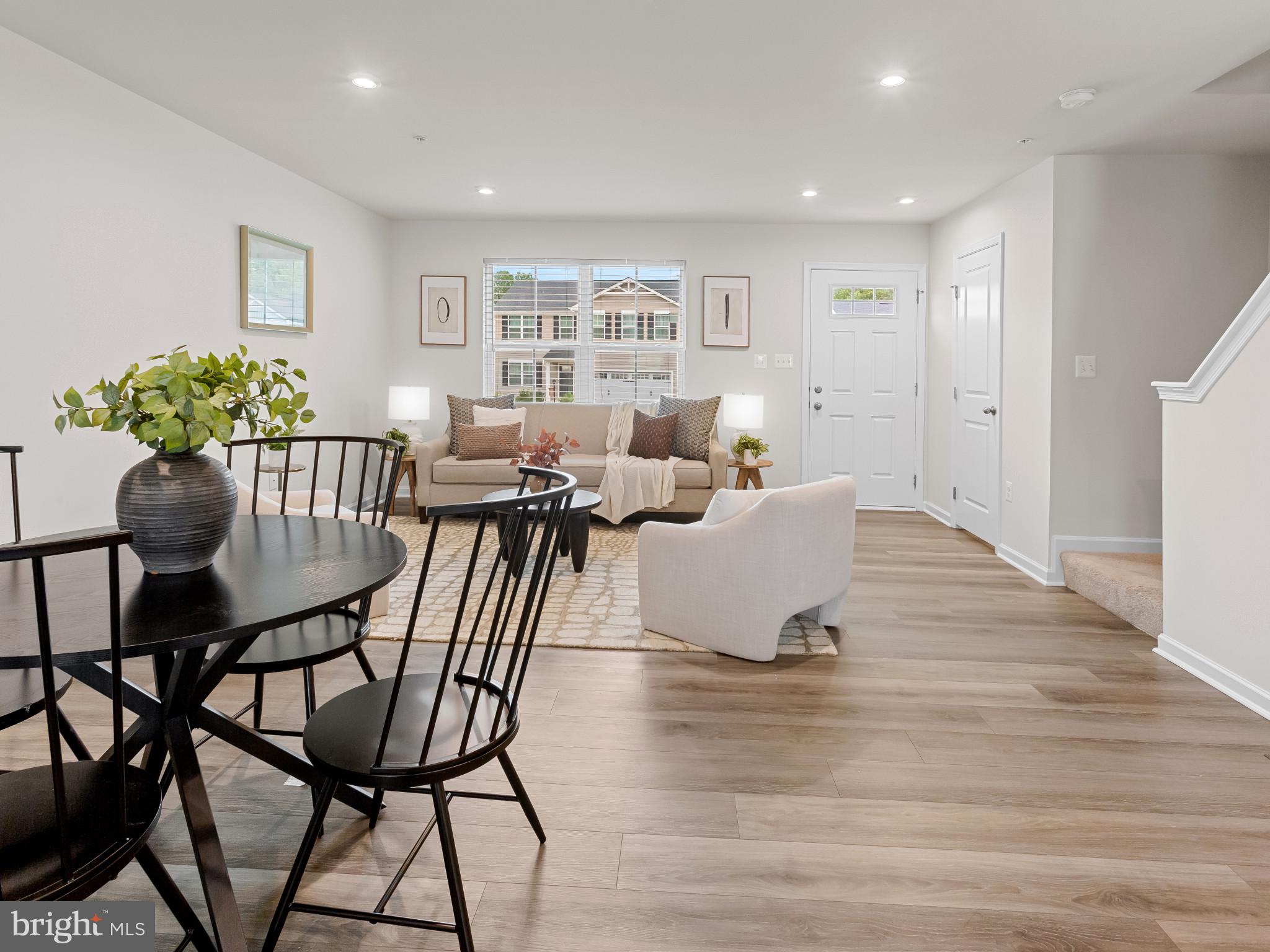 5505 Vergo Road Capitol Heights, MD 20743 - Photo 6 of 42 a view of a dining room with furniture and a potted plant
