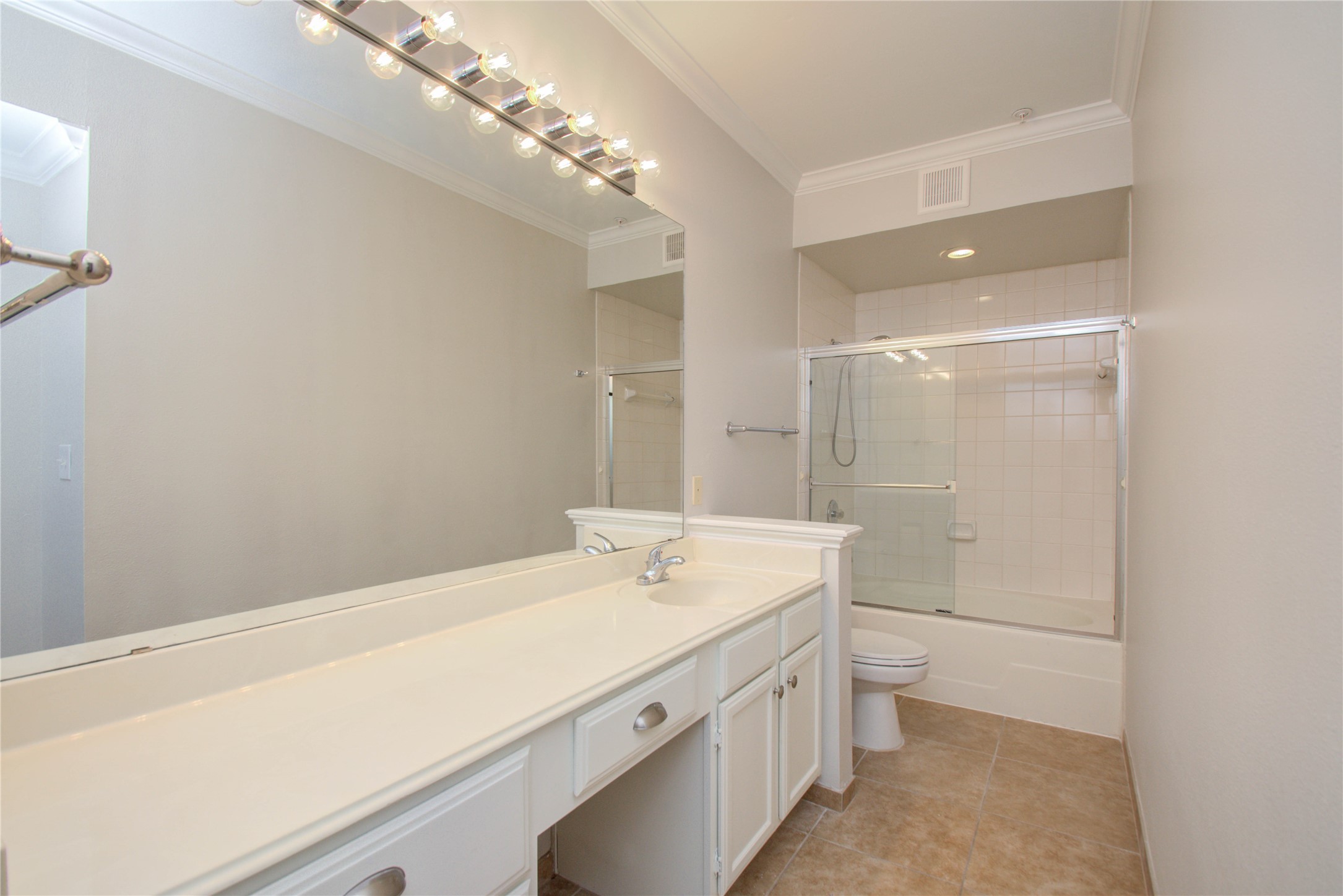 2111 Welch Street, Unit A321 Houston, TX 77019 - Photo 12 of 25 a bathroom with a sink a toilet and shower