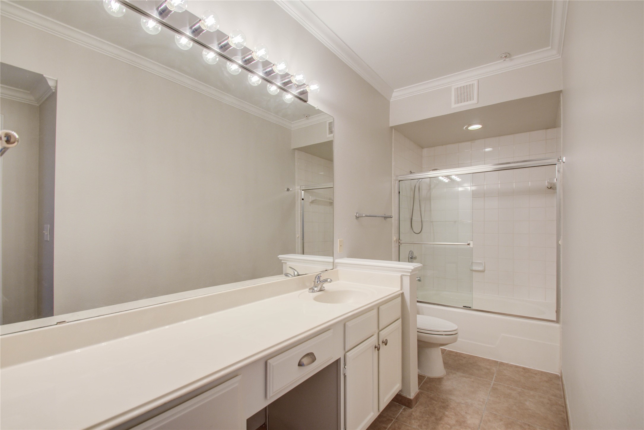 2111 Welch Street, Unit A321 Houston, TX 77019 - Photo 14 of 25 a bathroom with a sink a toilet and shower