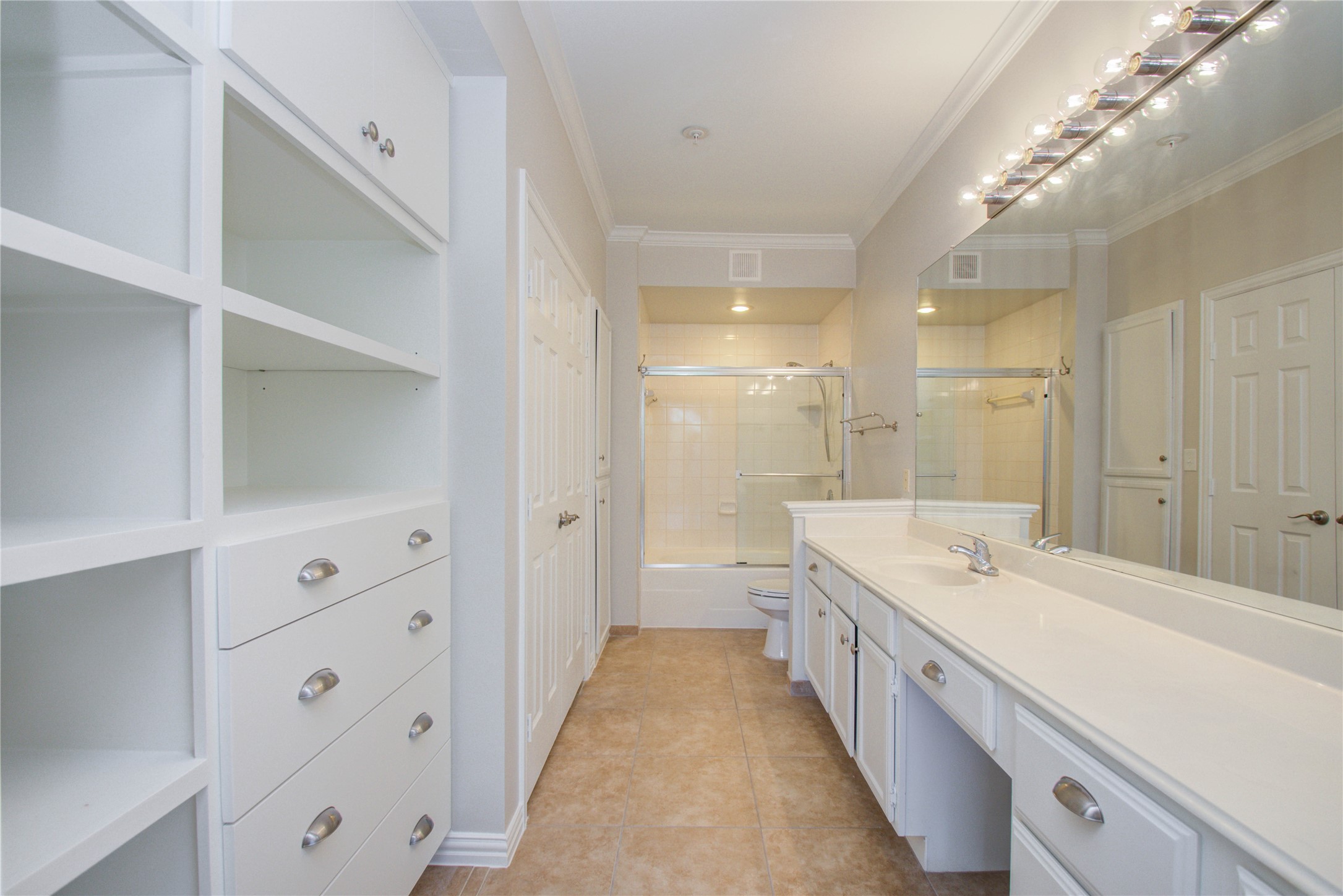 2111 Welch Street, Unit A321 Houston, TX 77019 - Photo 18 of 25 a spacious bathroom with a double vanity sink and mirror