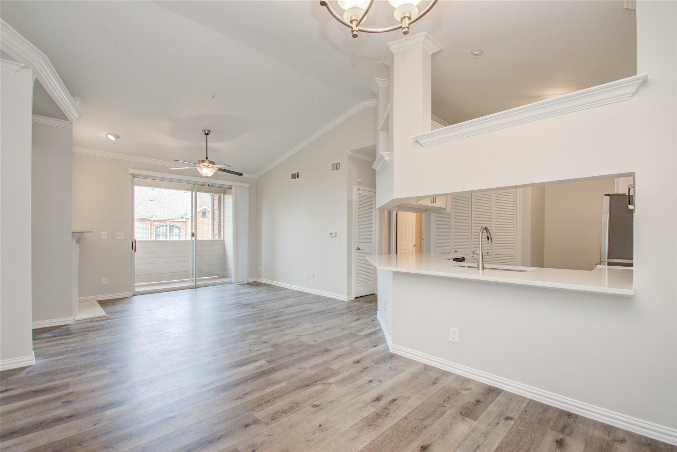 2111 Welch Street, Unit A321 Houston, TX 77019 - Photo 2 of 25 a view of an empty room with wooden floor and a window