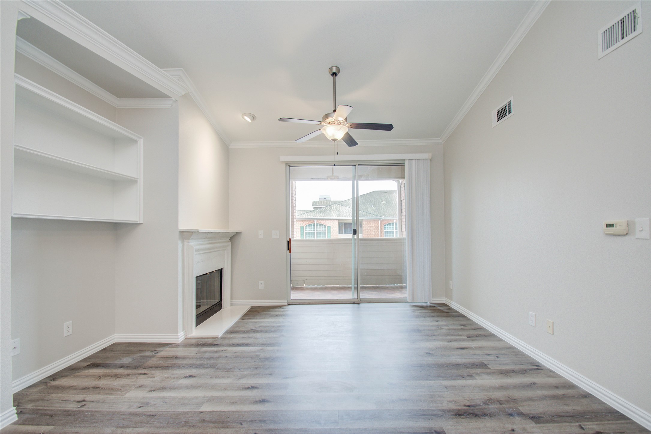2111 Welch Street, Unit A321 Houston, TX 77019 - Photo 3 of 25 a view of livingroom with hardwood floor and a ceiling fan