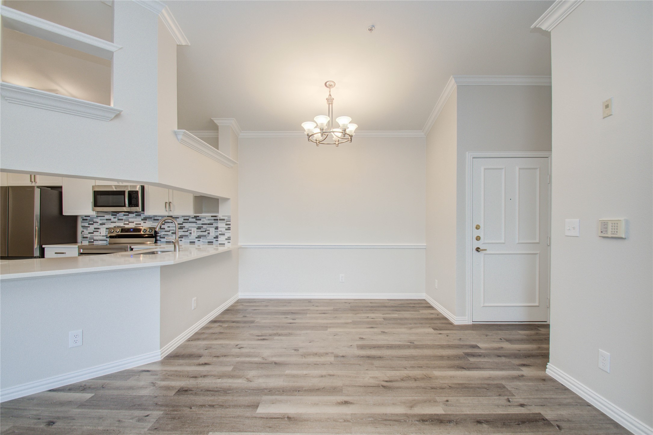 2111 Welch Street, Unit A321 Houston, TX 77019 - Photo 8 of 25 a kitchen with stainless steel appliances a stove top oven and cabinets