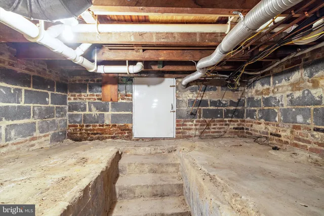 a view of empty room with wooden walls