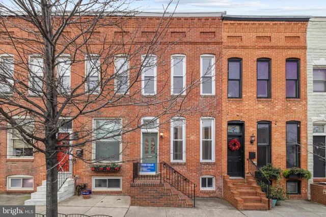 a front view of a building with many windows