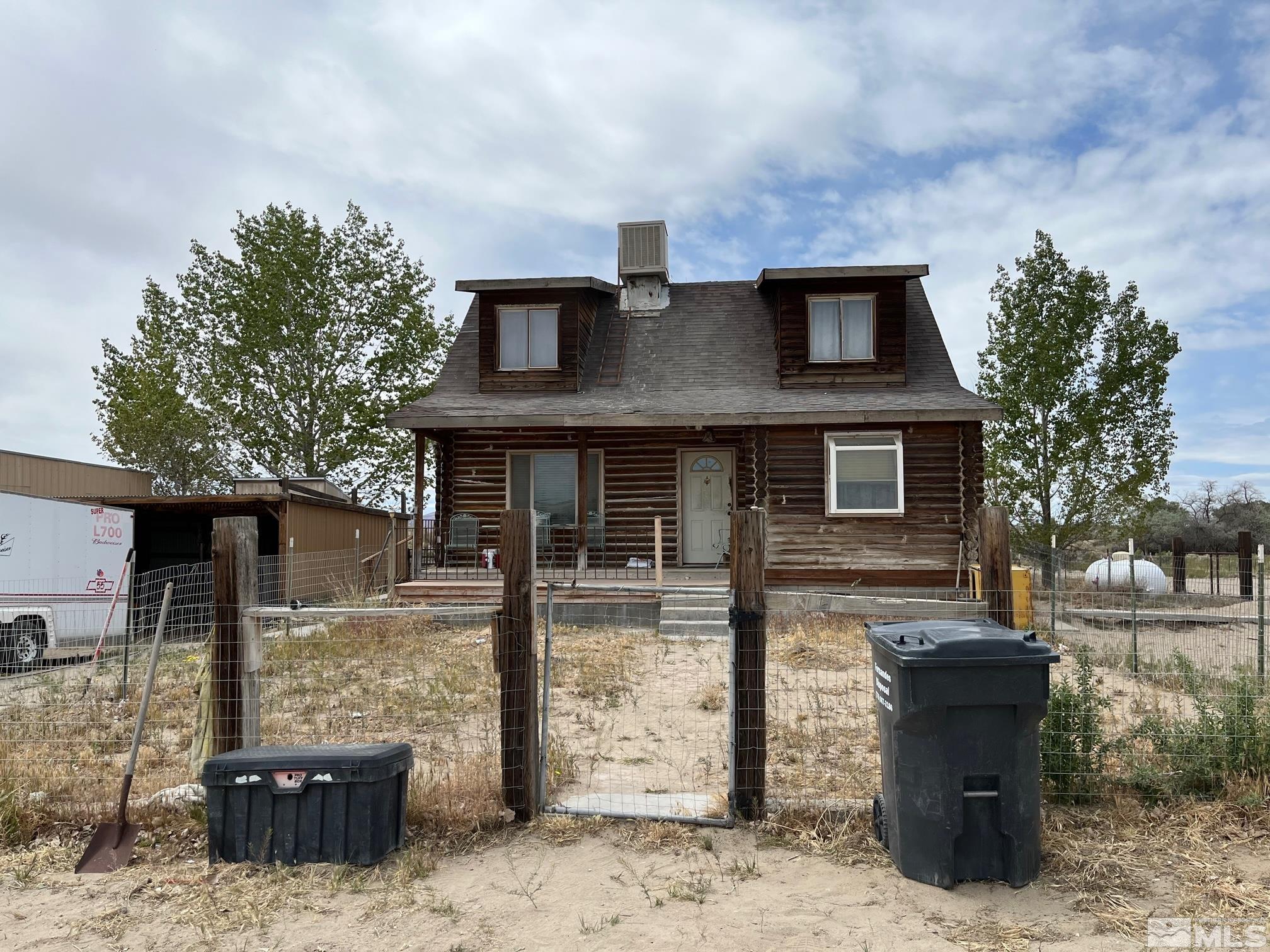 3501 Boyer Road Fallon, NV 89406 - Photo 1 of 14 a front view of a house with garden