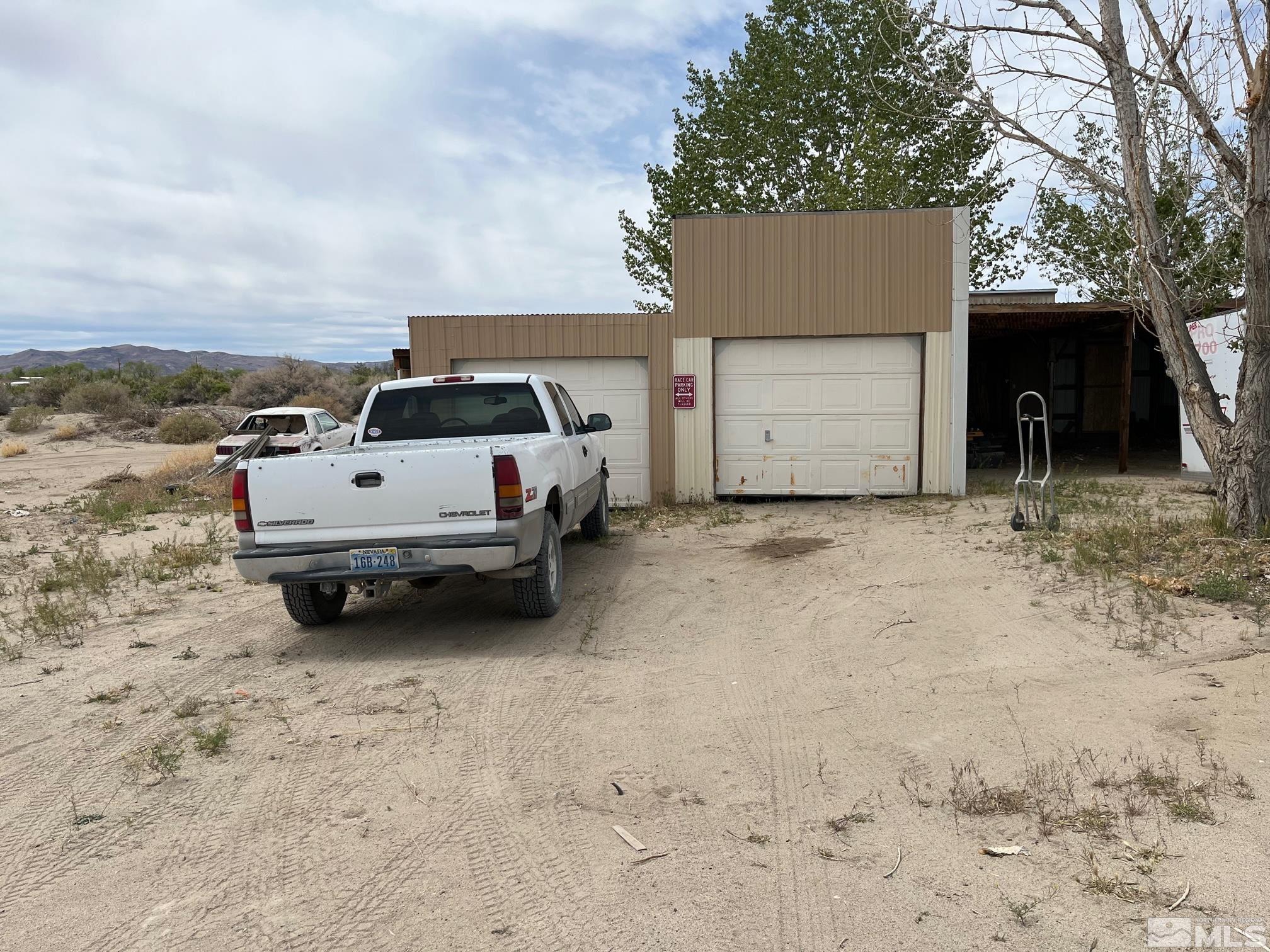 3501 Boyer Road Fallon, NV 89406 - Photo 12 of 14 a white car parked in front of house