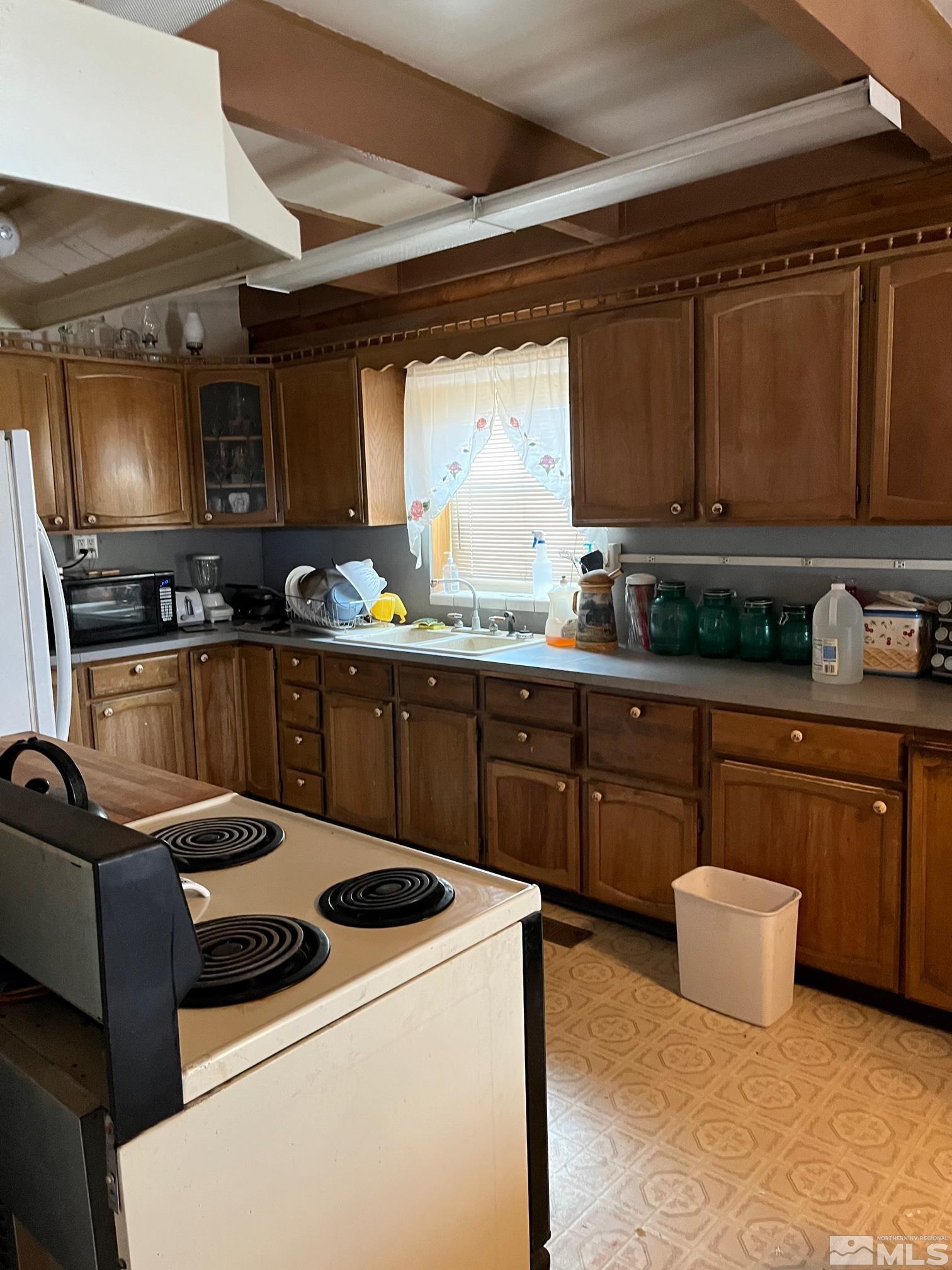 3501 Boyer Road Fallon, NV 89406 - Photo 2 of 14 a kitchen with a sink a stove and cabinets