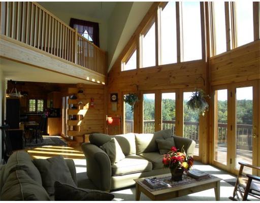 33 Town Farm Road Heath, MA 01346 - Photo 8 of 22 a living room with furniture and floor to ceiling windows