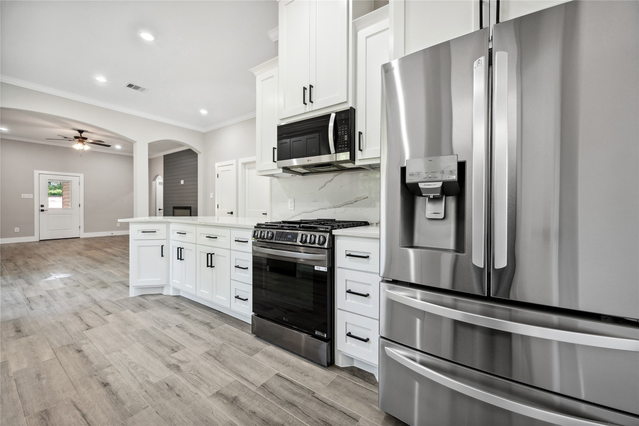 139 Popular Street Onalaska, TX 77360 - Photo 11 of 24 a kitchen with stainless steel appliances a refrigerator stove and sink