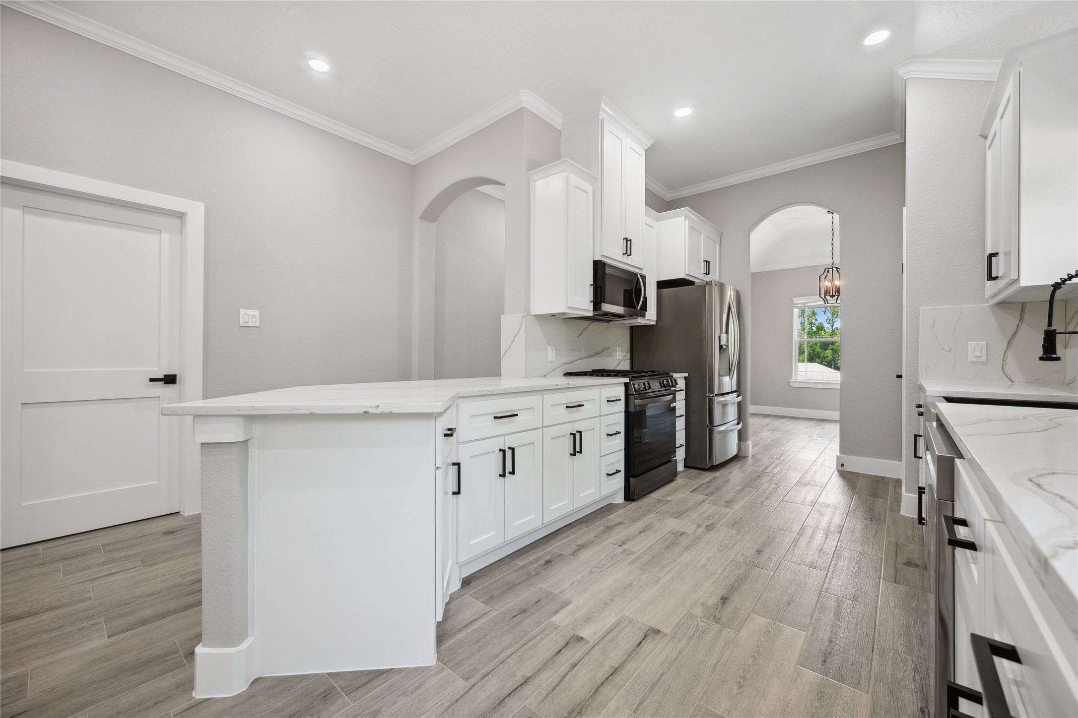 139 Popular Street Onalaska, TX 77360 - Photo 12 of 24 a kitchen with a sink cabinets and wooden floor