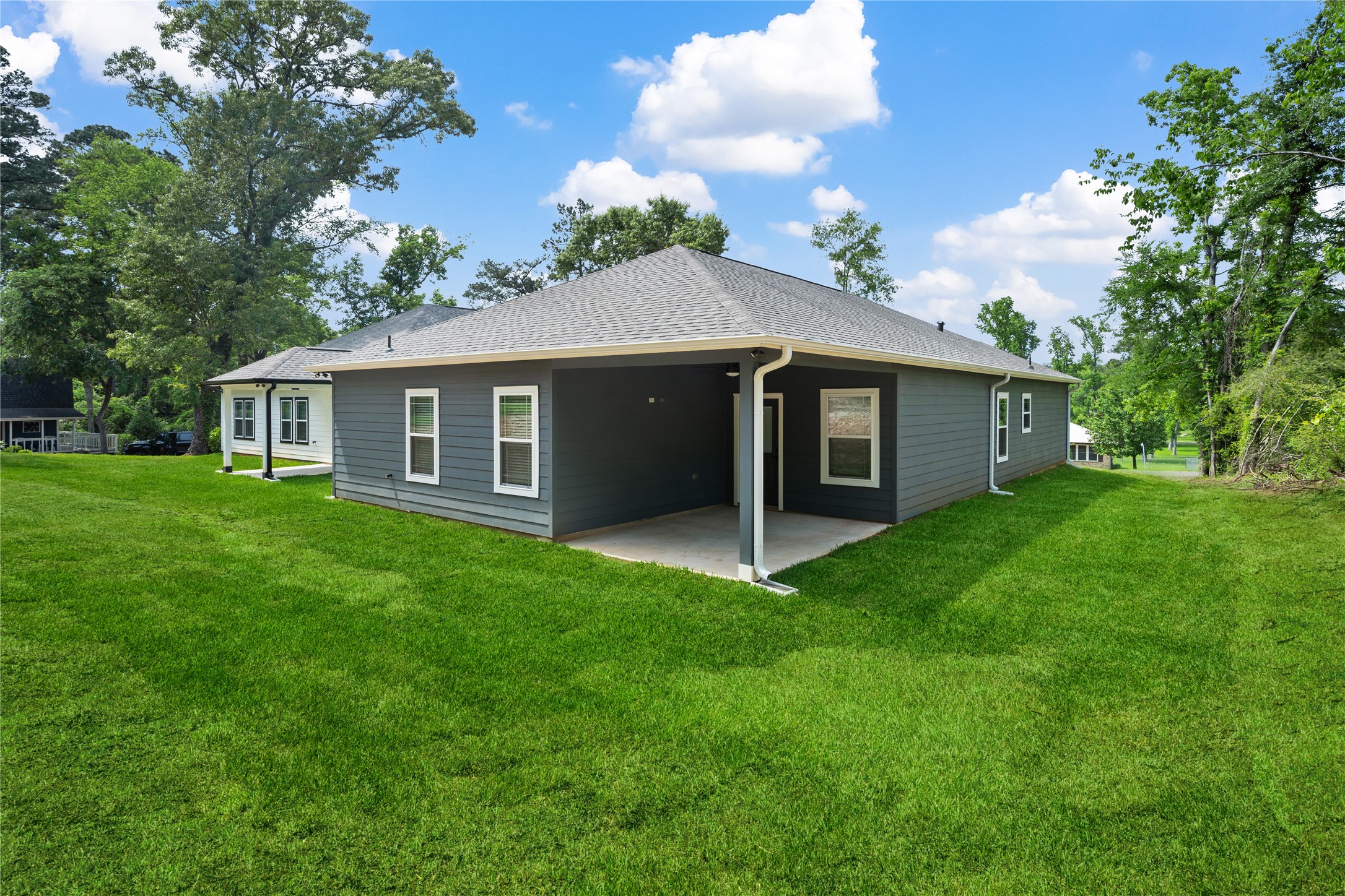 139 Popular Street Onalaska, TX 77360 - Photo 2 of 24 a view of a house with a yard